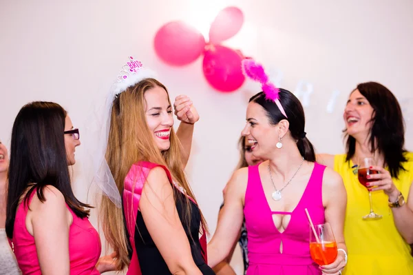 Bride and bridesmaids celebrating hen party