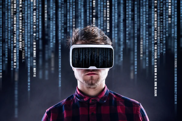 Man wearing virtual reality goggles.