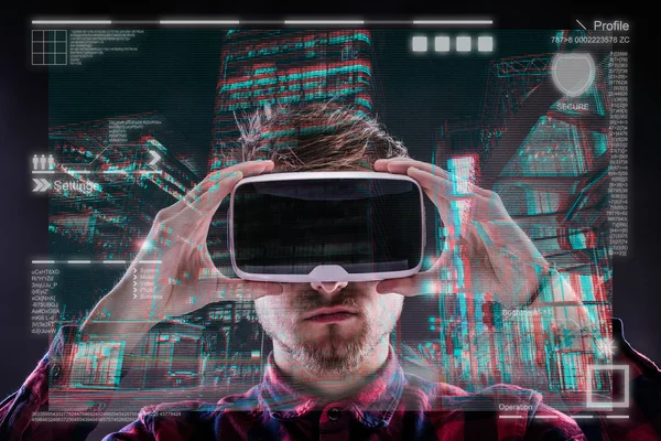 Man wearing virtual reality goggles.