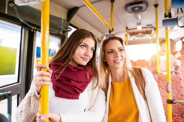 Young women traveling by bus