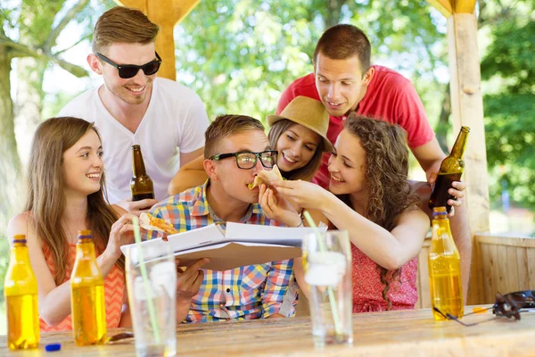 Happy friends in pub garden