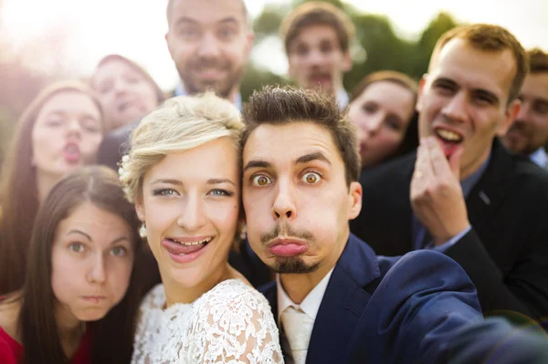 Newlyweds with their firends taking selfie