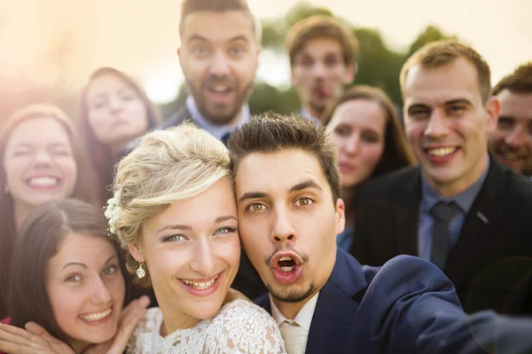 Newlyweds with their firends taking selfie