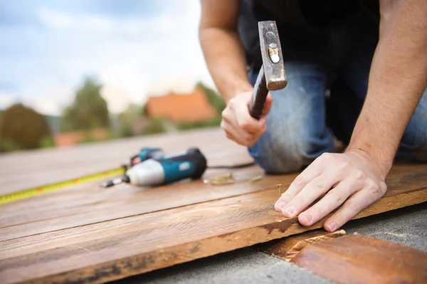 Handyman working with hammer