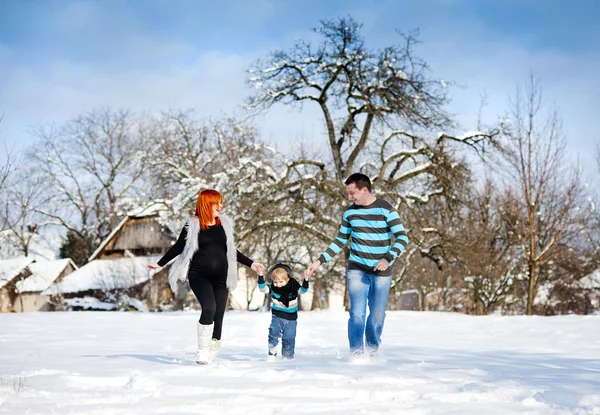Parents with child in winter