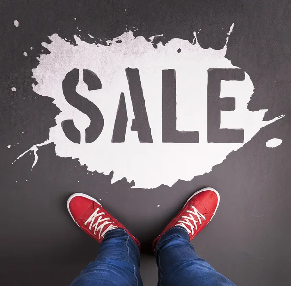 Sale text with red sneakers