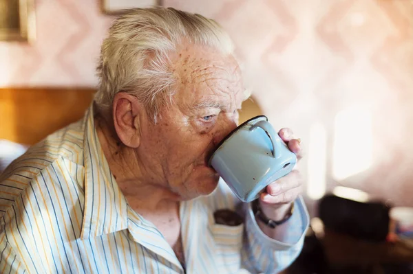 Senior man drinking water