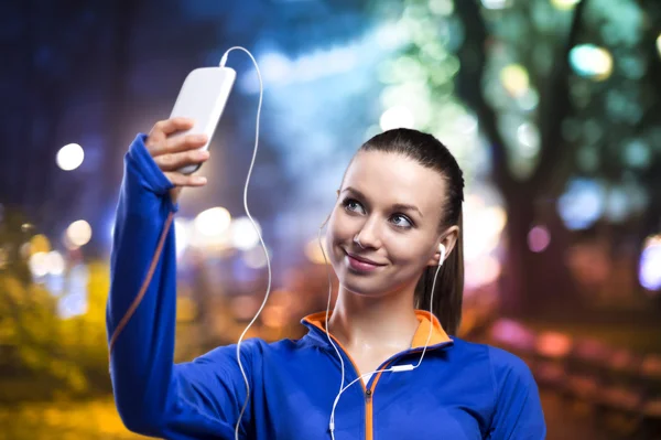 Woman taking selfie on mobile phone