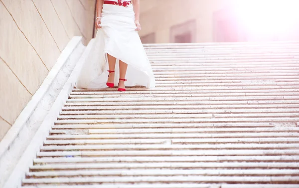 Bride running down the stairs