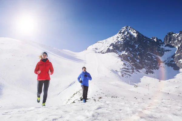 Couple jogging in winter