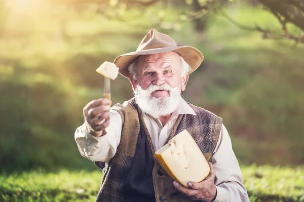 Farmer eating cheese