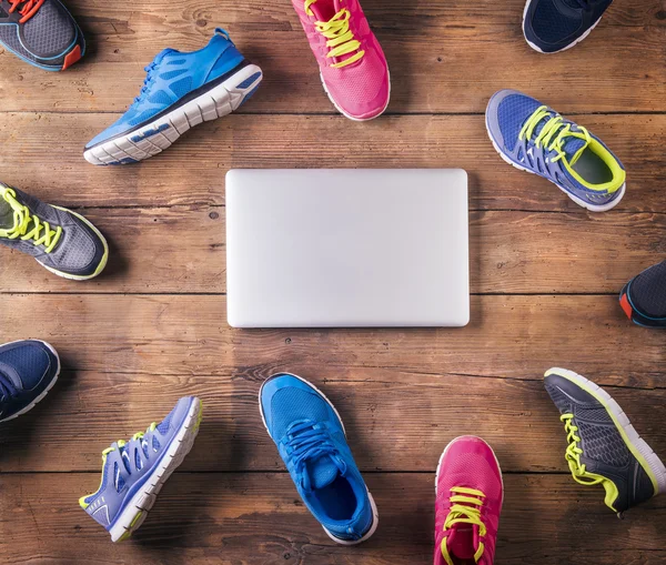 Running shoes and notebook on the floor