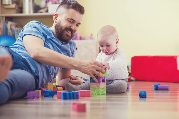 Father playing with his daughter