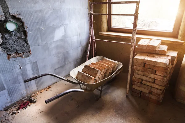 Wheelbarrow full of bricks