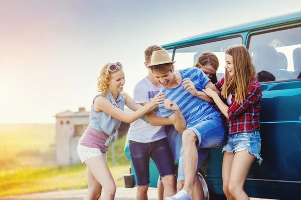 Young hipster friends on road trip