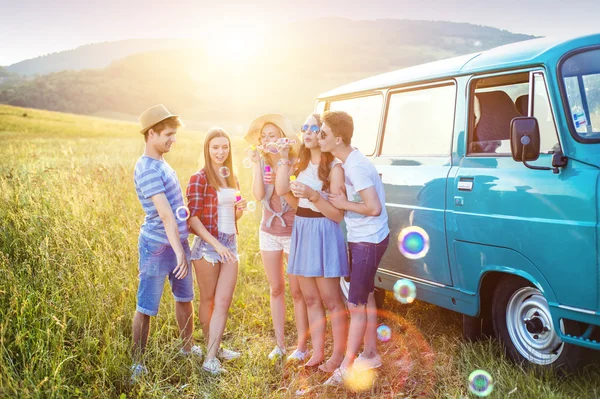 Young hipster friends on road trip