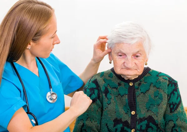 Elderly woman and young doctor