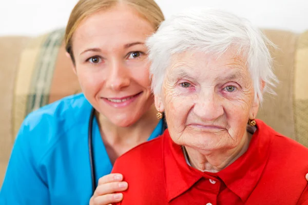 Elderly woman and young doctor