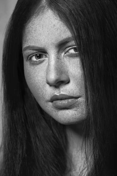 Black and white beauty with freckles.