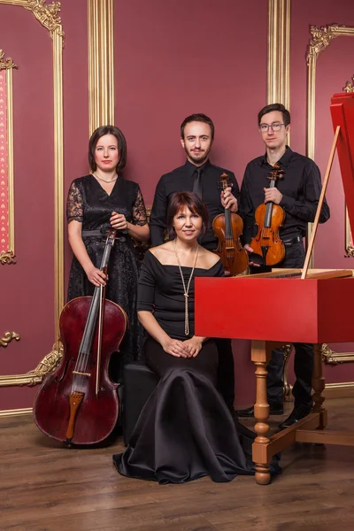 Classical music quartet posing after the concert.