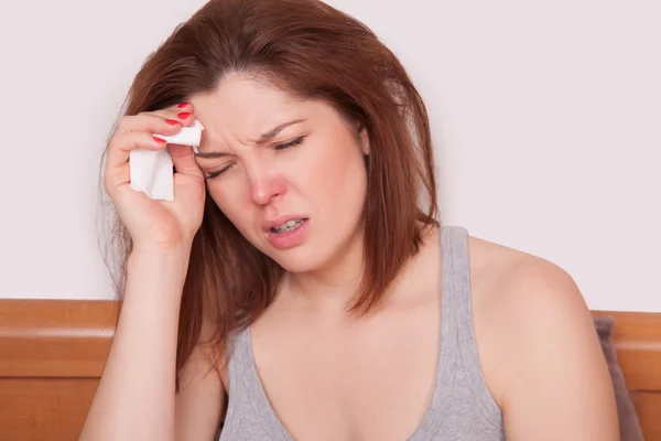 Sick Woman. Flu. Woman Caught Cold. Sneezing into Tissue. Headache. Virus. copy space