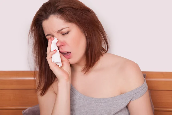 Sick Woman. Flu. Woman Caught Cold. Sneezing into Tissue. Headache. Virus. copy space