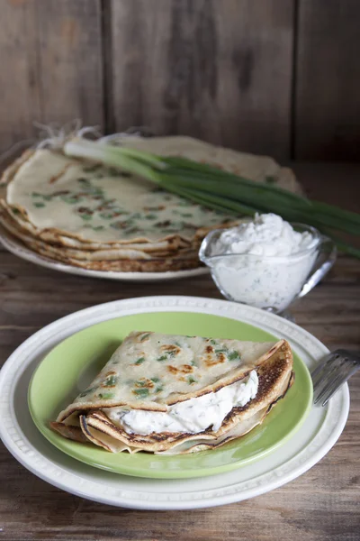 Pancakes with green onions and tartar sauce.
