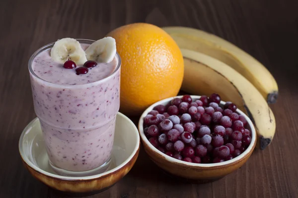 Smoothies of bananas, oranges and frozen cranberries  .