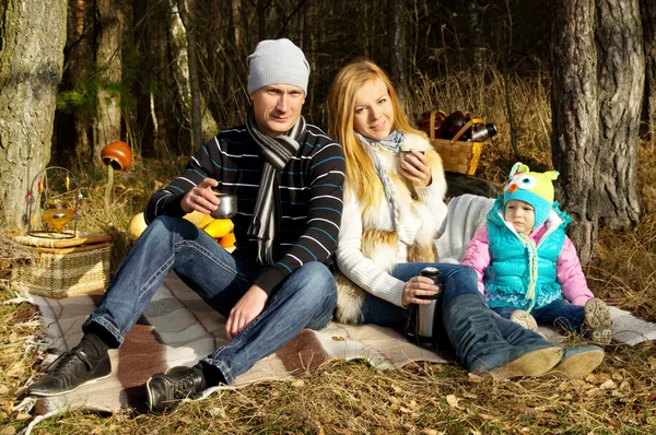 Young happy family in nature