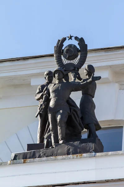 Sculptures of Soviet soldiers, workers and peasants on the roof of the building, the city of Orel, March 2014 close-up