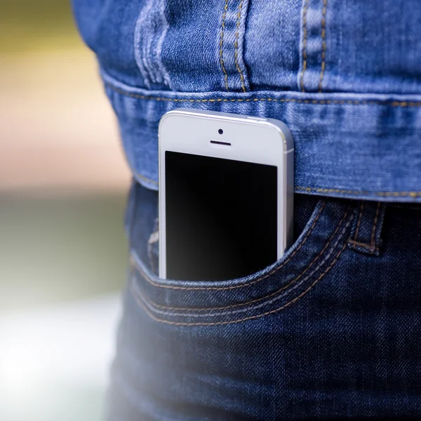 Smartphone in everyday life. phone in jeans pocket.