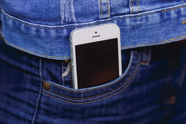 Smartphone in everyday life. phone in jeans pocket.