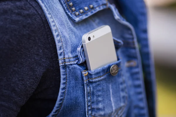 Smartphone in everyday life. phone in jeans pocket.