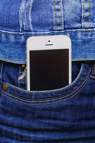 Smartphone in everyday life. phone in jeans pocket.