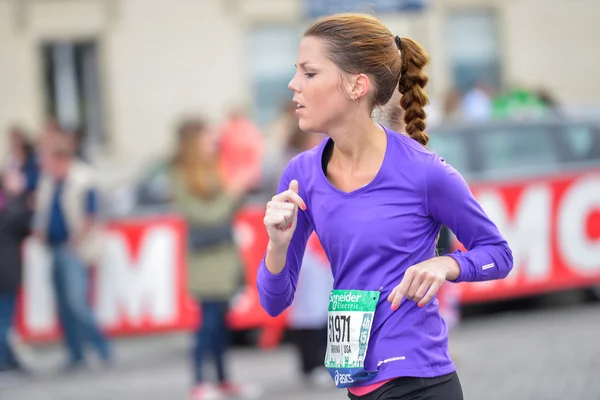 PARIS, FRANCE - APRIL  06 : girl isolated  at Paris International Marathon on April 06, 2014 in Paris, France