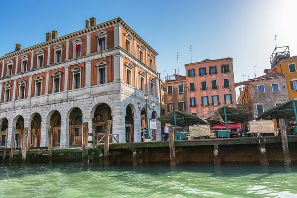 VENICE, ITALY - MAR 18 - local market on the edge of canal grand