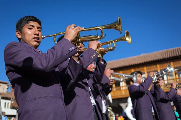 Unknown musicians of a brass band on parade in Cuzco, Peru