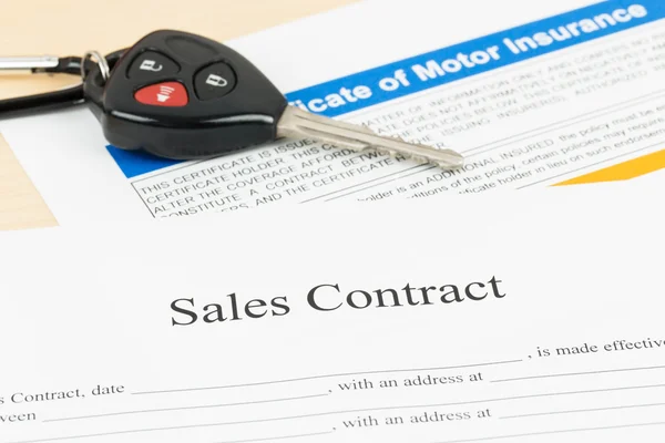 Car sales contract document with key