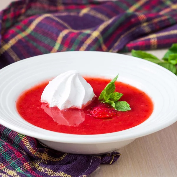 Delicious sweet strawberry soup with meringue, mint, cool summer