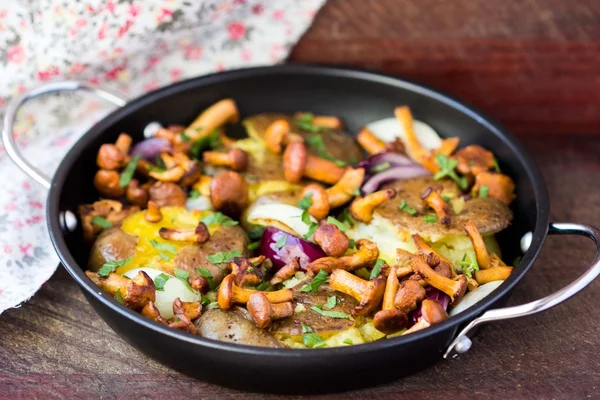 Fried potatoes with chanterelle mushrooms, onions, delicious veg