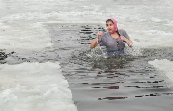 Bathing in the hole in the religious holiday Epiphany. Emotions, courage, courage.People bathe in the river in winter Samara. City Novomoskovsk Dnipropetrovsk region January 19, 2016