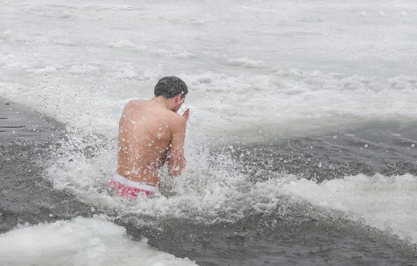 Religious holiday of Epiphany .  Swimming in the river in the winter. Healthy lifestyle. People bathe in the river in winter Samara city Novomoskovsk Dnipropetrovsk region January 19, 2016