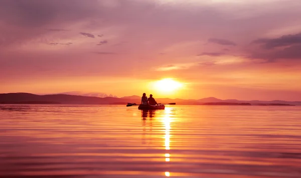 Couple in love at sunset on the boat