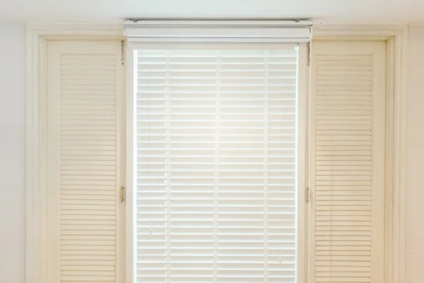 Blinds window in bedroom interior