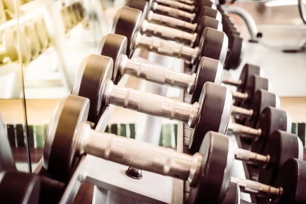 Dumbbell equipment in fitness gym room