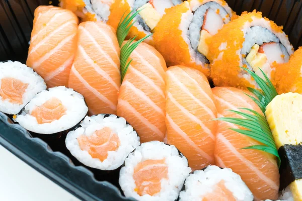 Sushi box with roll fresh salmon sushi
