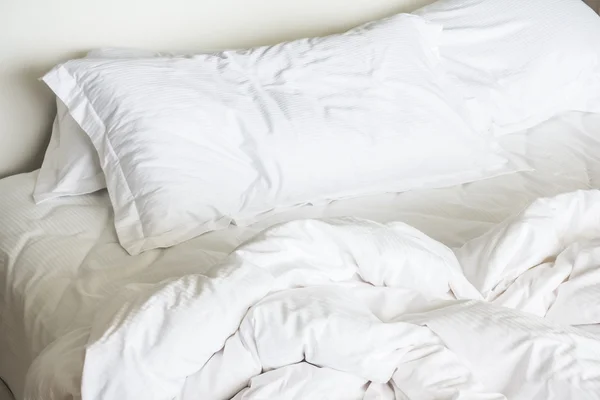 White sheet pillows