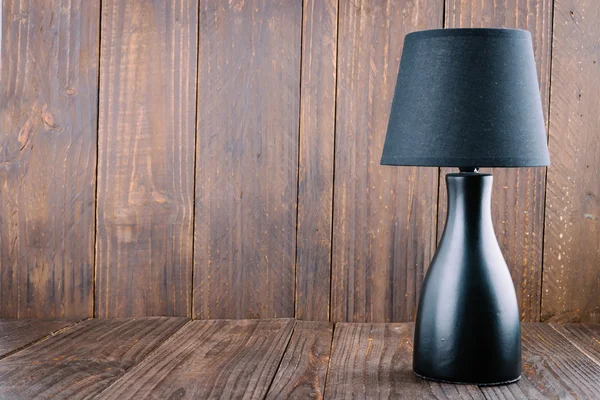 Unlit lamp on wood