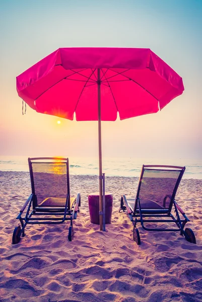 Sun loungers and umbrella