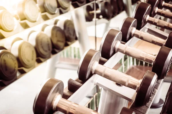 Dumbbell equipment in fitness gym room